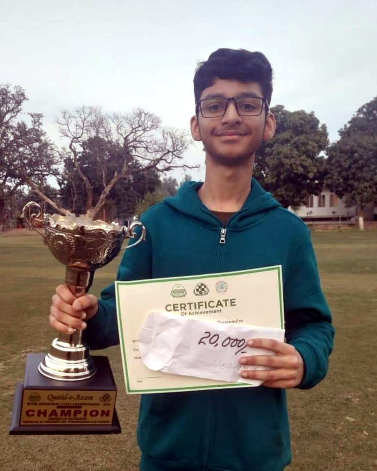 Ayan Ahsan with the Quaid-e-Azam Inter Divisional Chess Championship trophy, Under-16 champion