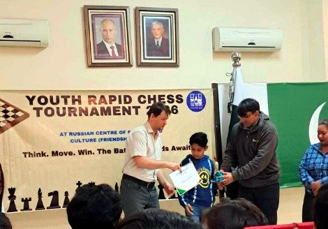 Muhammad Haseeb receiving his certificate at the youth rapid chess tournament