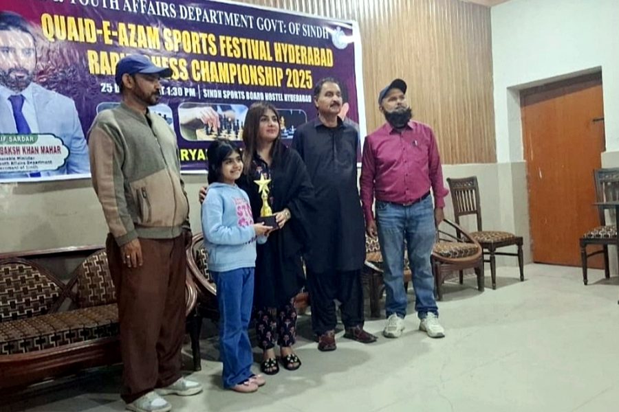 Rumaisa Afif receiving the winner's trophy at the Quaid-e-Azam Sports Festival rapid chess championship